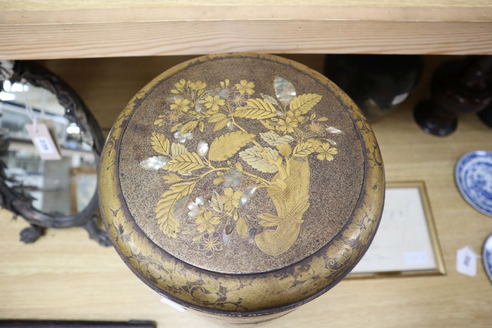 A 19th century Japanese sectional stack of mother of pearl and lacquered boxes, on hardwood stand, overall height 46cm